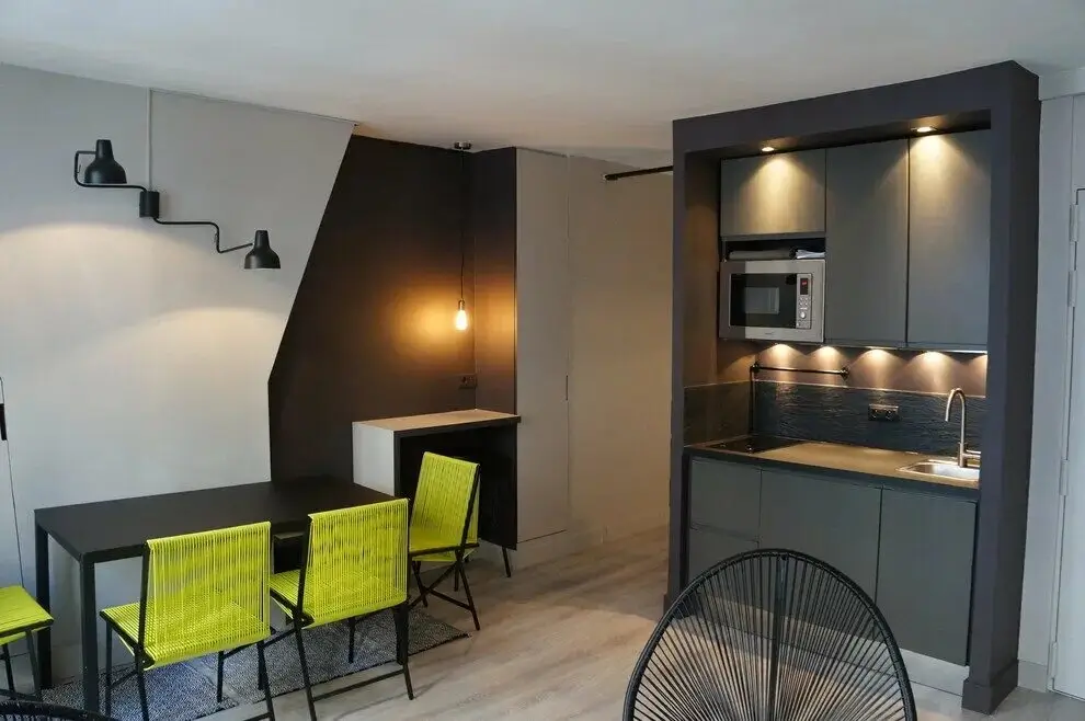 A studio room with a small kitchenette area.