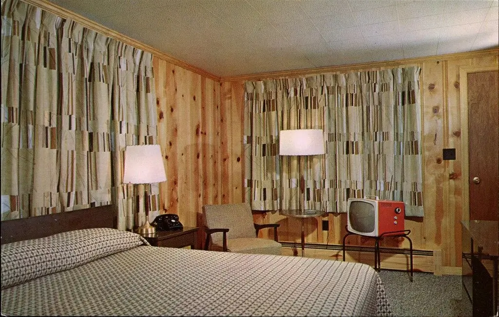 An old, outdated hotel room before renovation.
