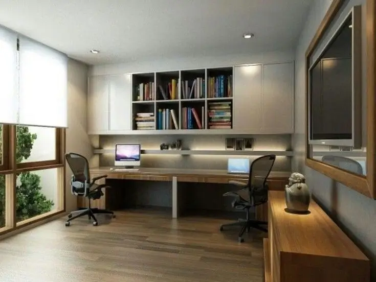 A stylish and compact single room with a desk.