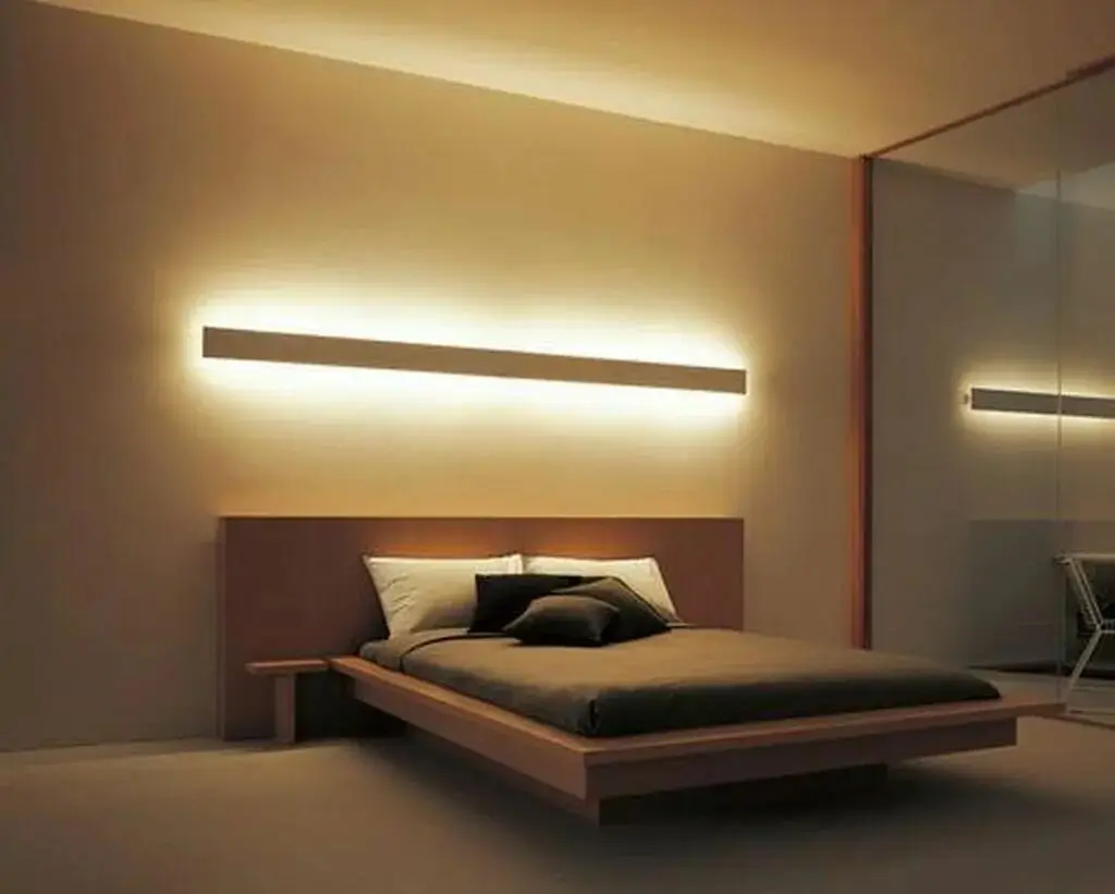 A designer light fixture casting a warm glow over a minimalist seating area.