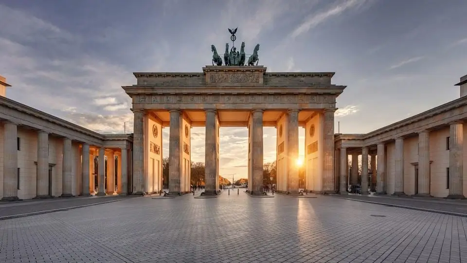 The Brandenburg Gate in Berlin during sunset.