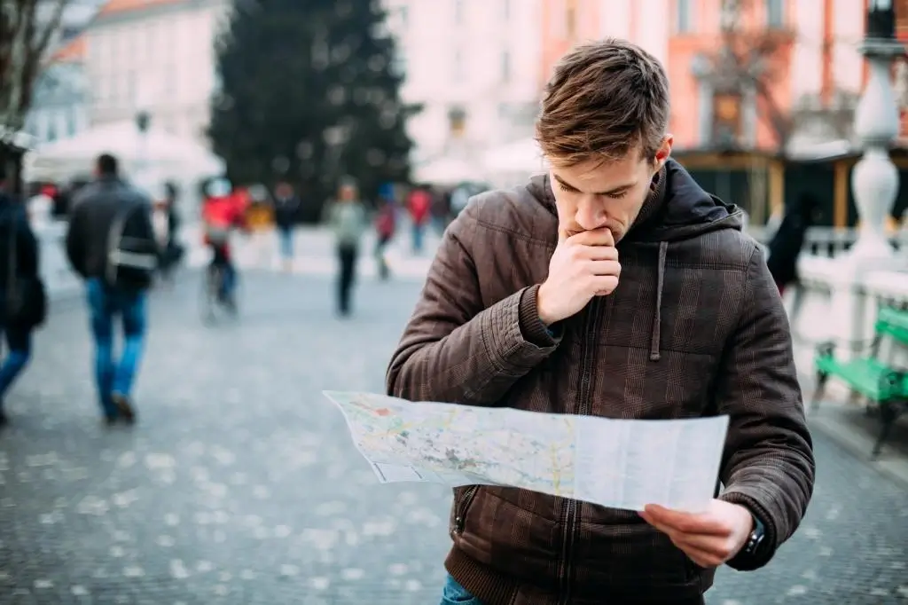 A person looking at a city map.