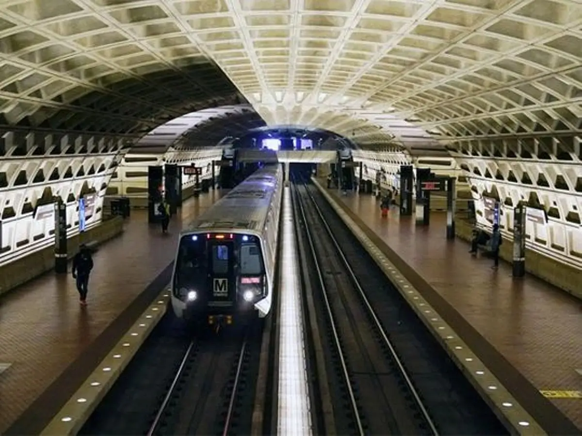A subway train arriving at a station platform.