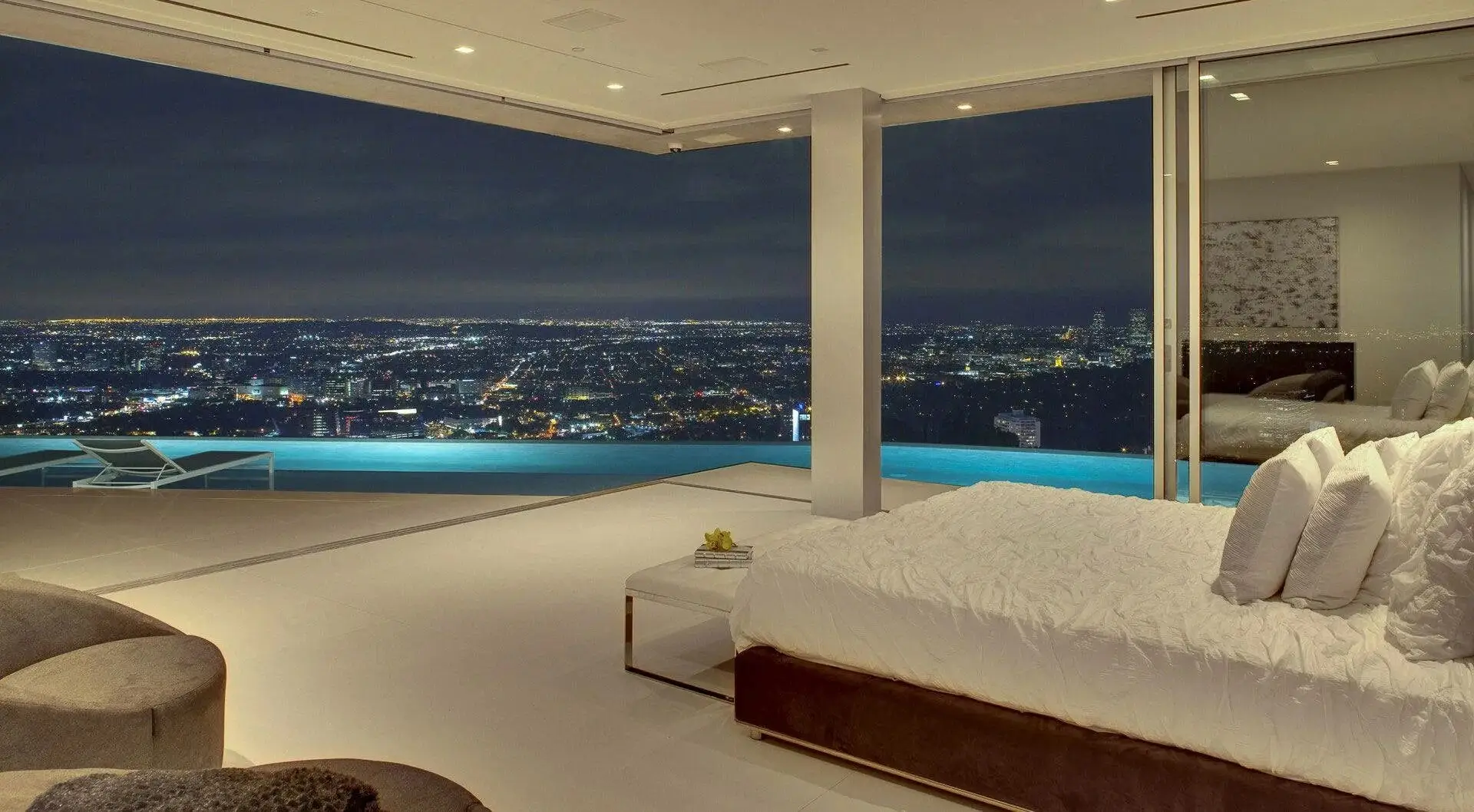 A premium room with a king bed and a large window with a city view.